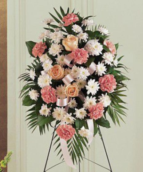 Pink and white standing easel spray of funeral flowers.
