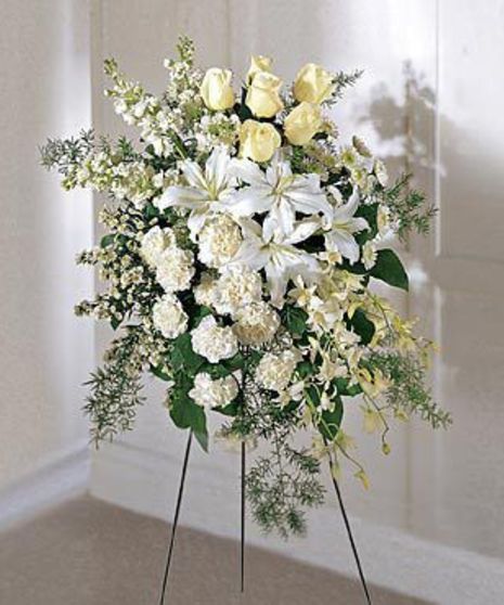 Standing white flower sympathy spray for a funeral.