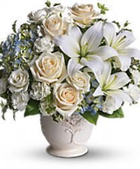 Blue and white flowers delivered in a French country style pot