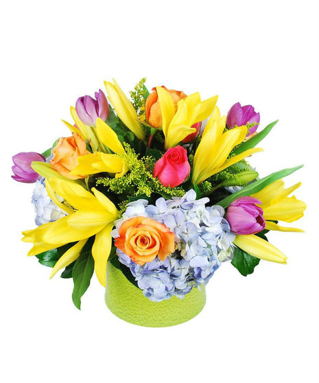Yellow, pink, orange, purple and blue flowers in a lime green vase.